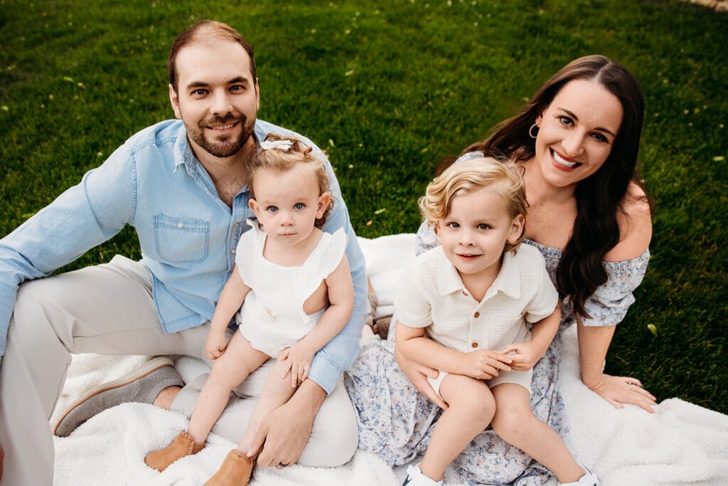 Joyful toddler and family during golden hour lifestyle session in Naperville, IL