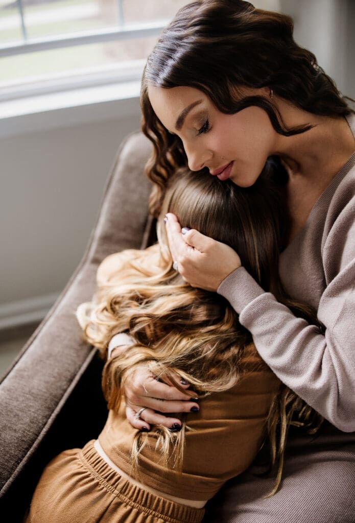 Mother and daughter snuggling in a lifestyle family photography session in Chicago, IL.